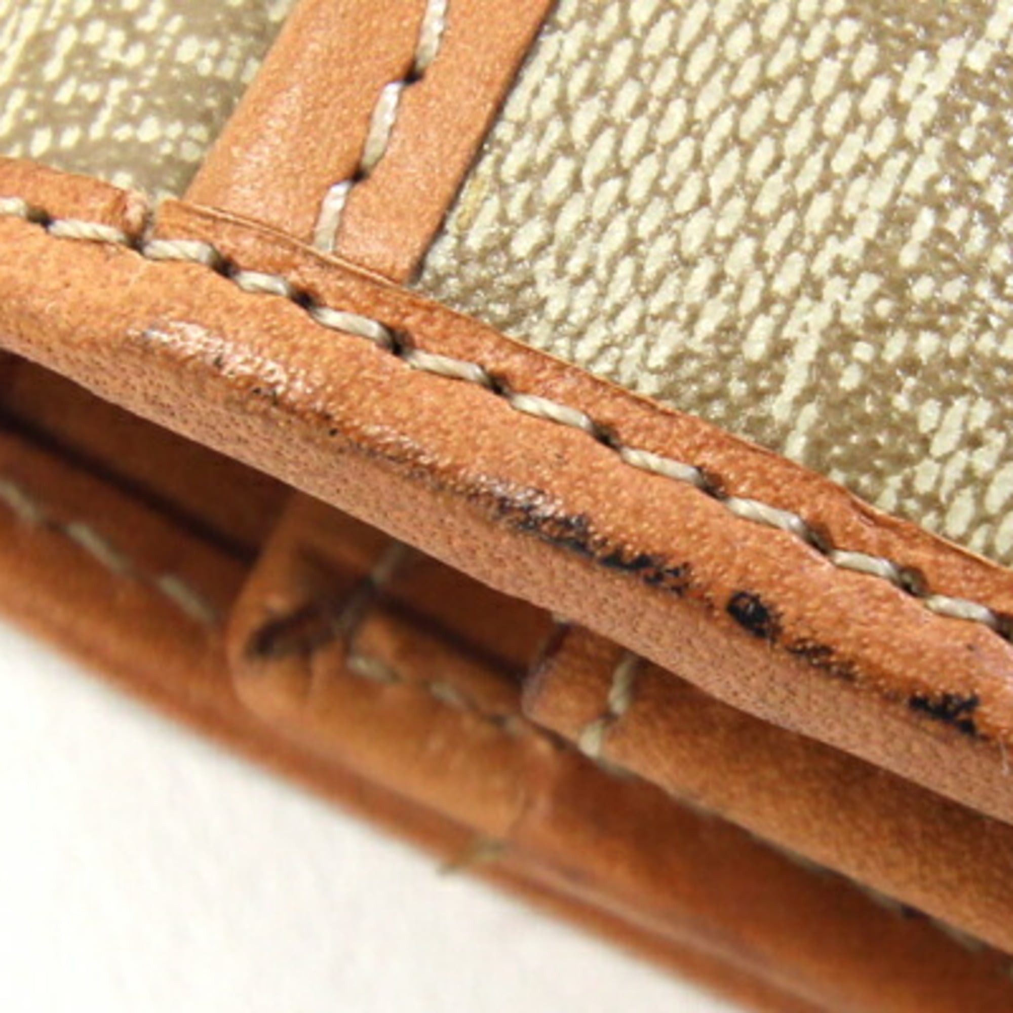 Celine bifold long wallet in beige macadam PVC leather. This is a women's wallet.