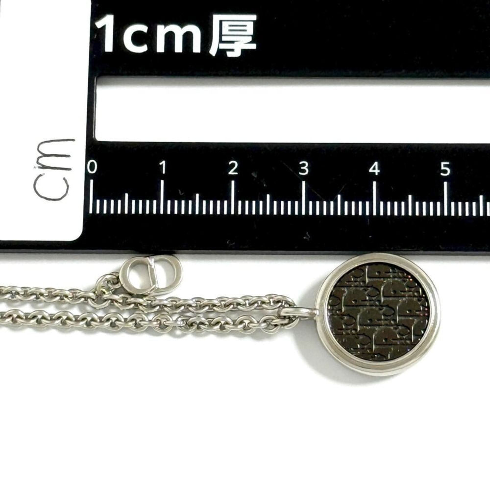 Christian Dior Dior Men's Oblique Circle Pendant Necklace in Silver and Black — Like New