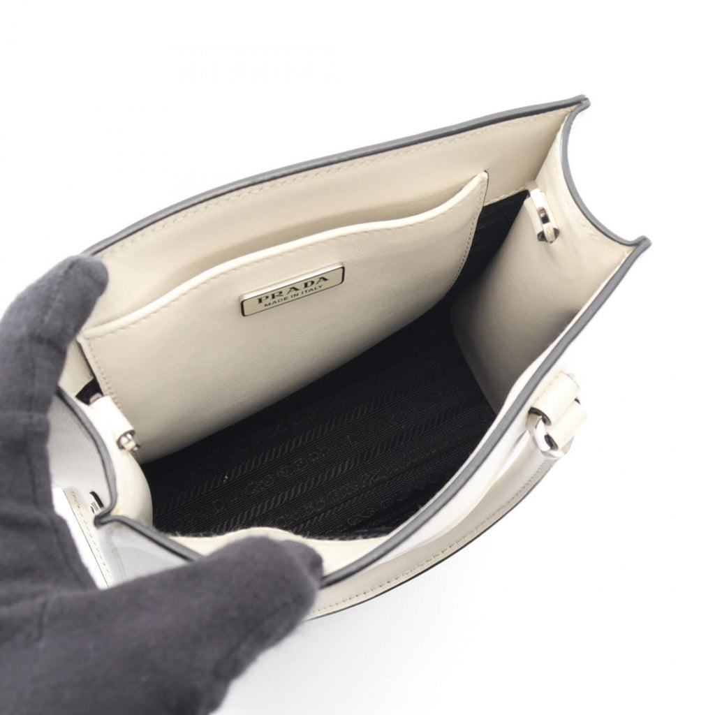 Prada embossed logo handbag, leather, women's, white, 1BA333