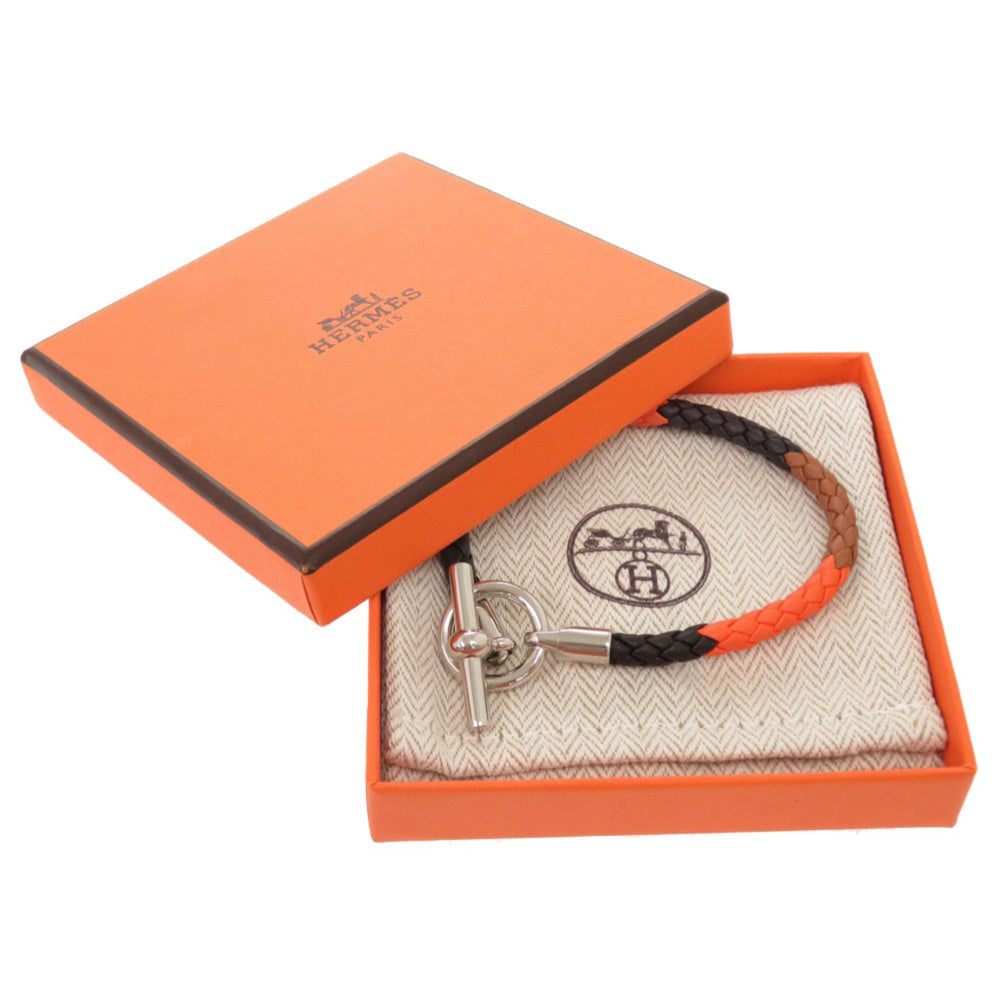 Hermes Like new Hermès Grennan leather bracelet in orange, brown, black, and silver hardware. 0991 — Like New