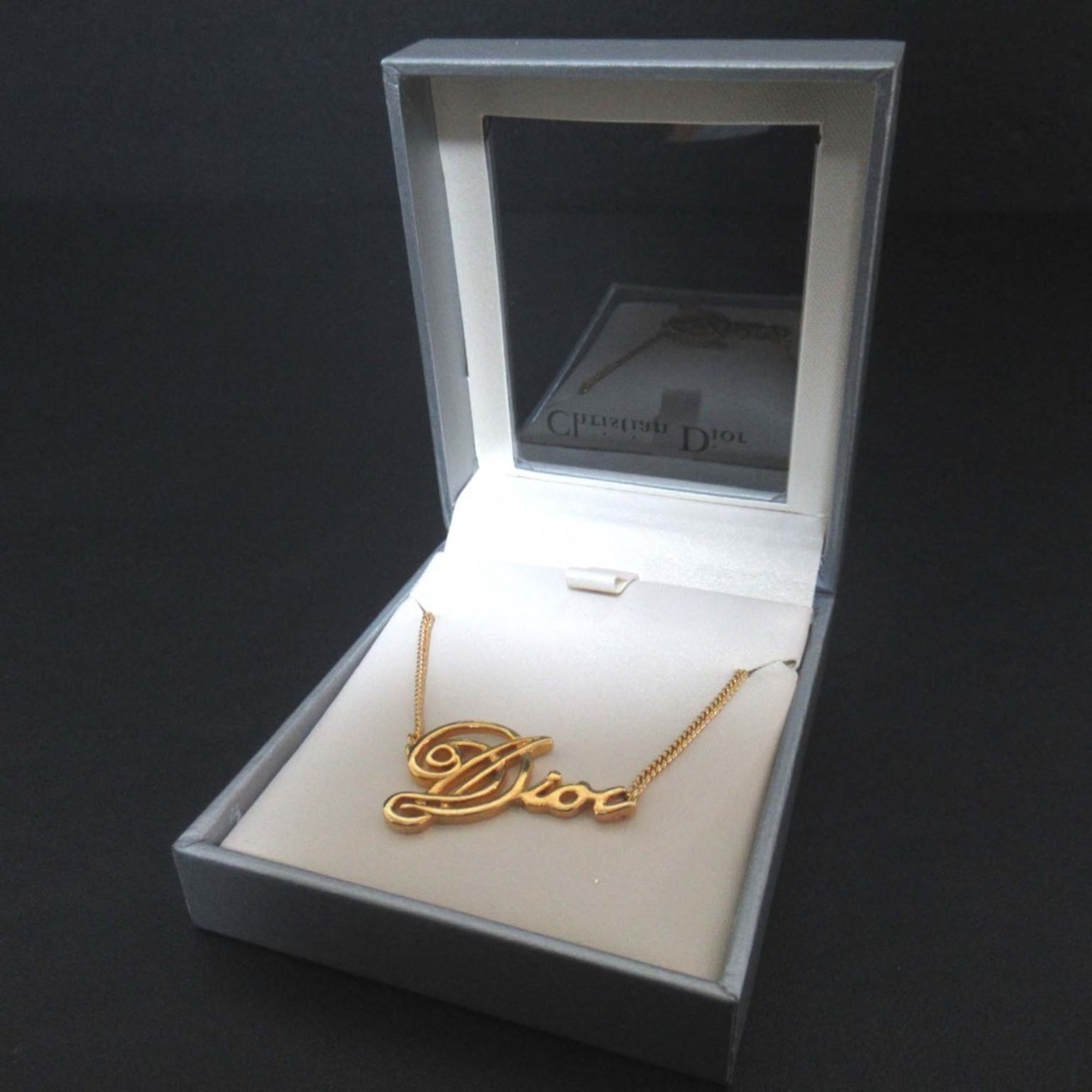 Vintage Christian Dior logo chain necklace pendant in GP gold for women.