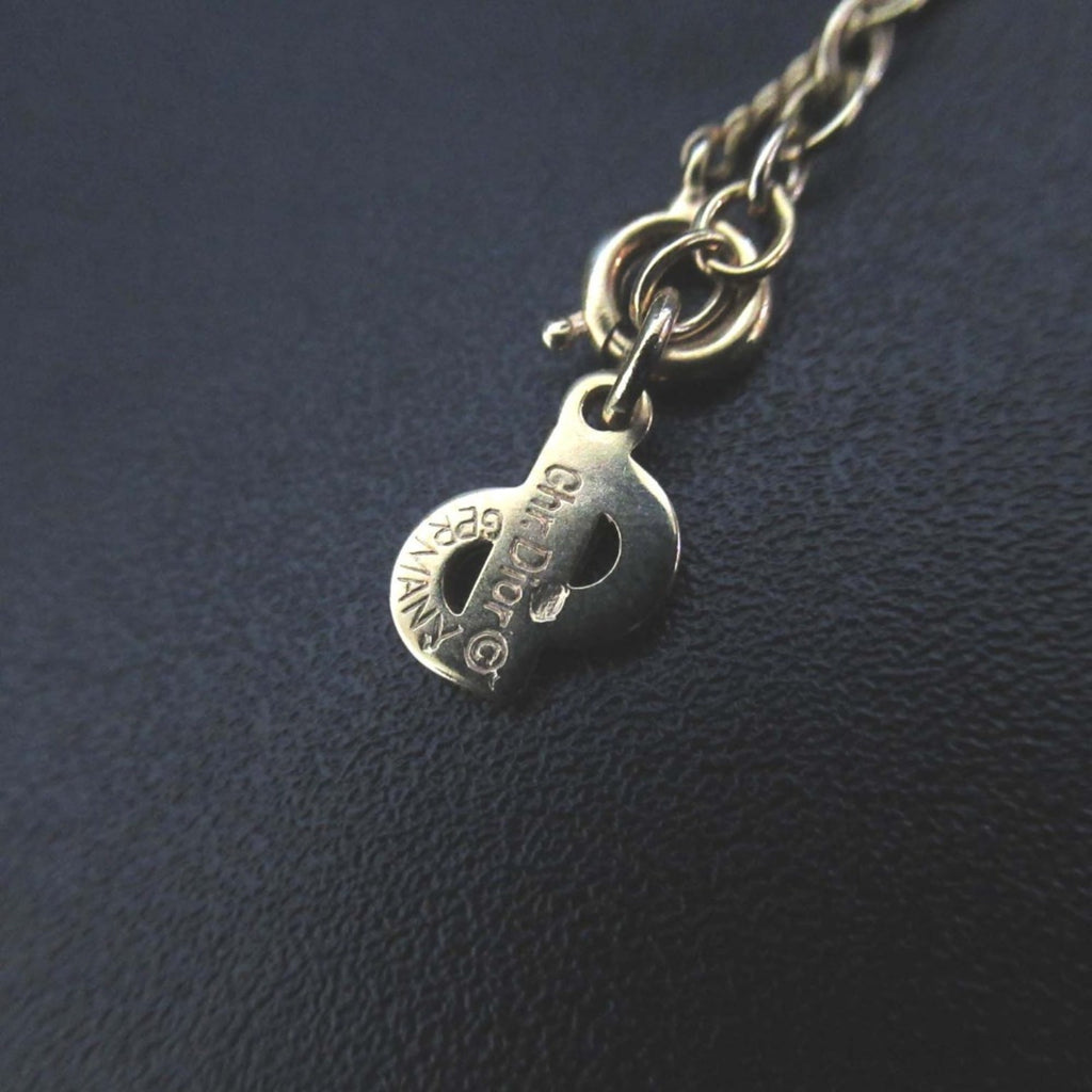 Vintage Christian Dior CD logo necklace pendant in gold for women.