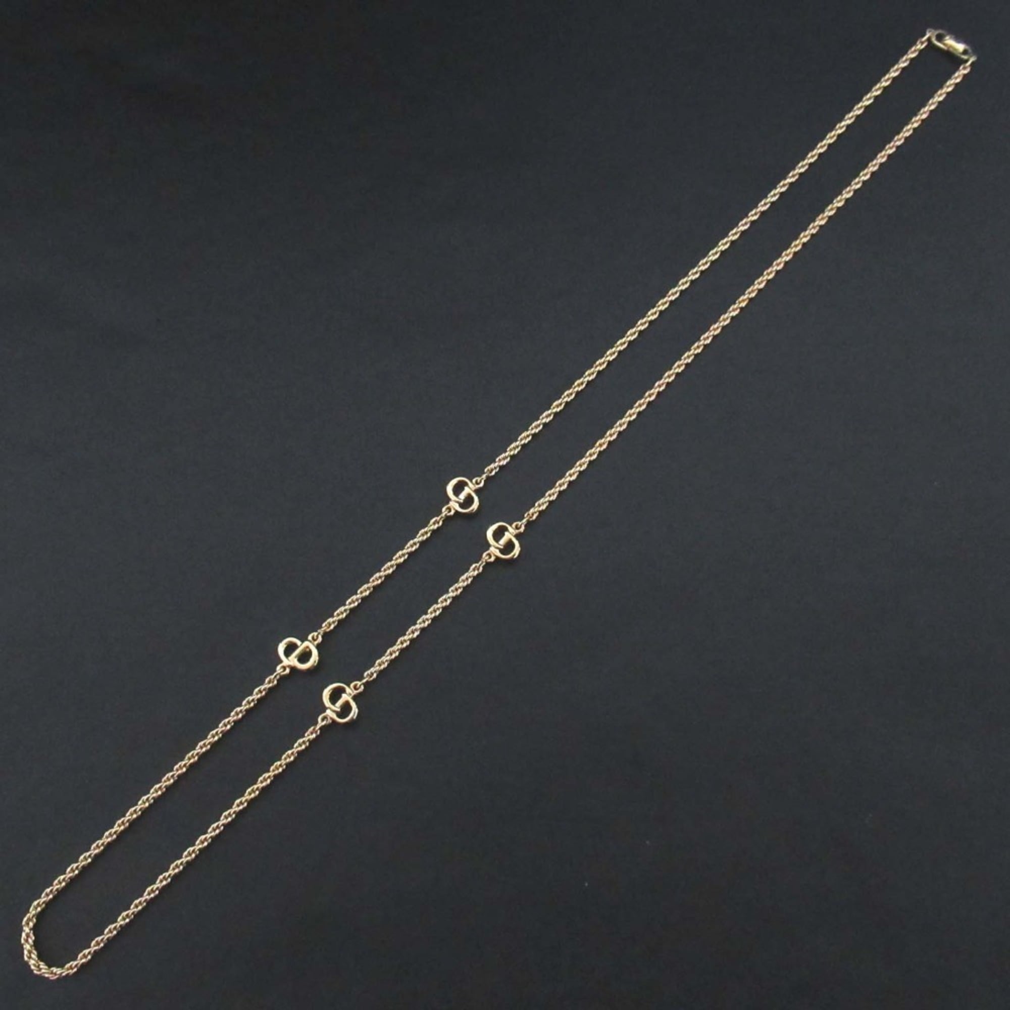 Vintage Christian Dior logo long necklace in gold.