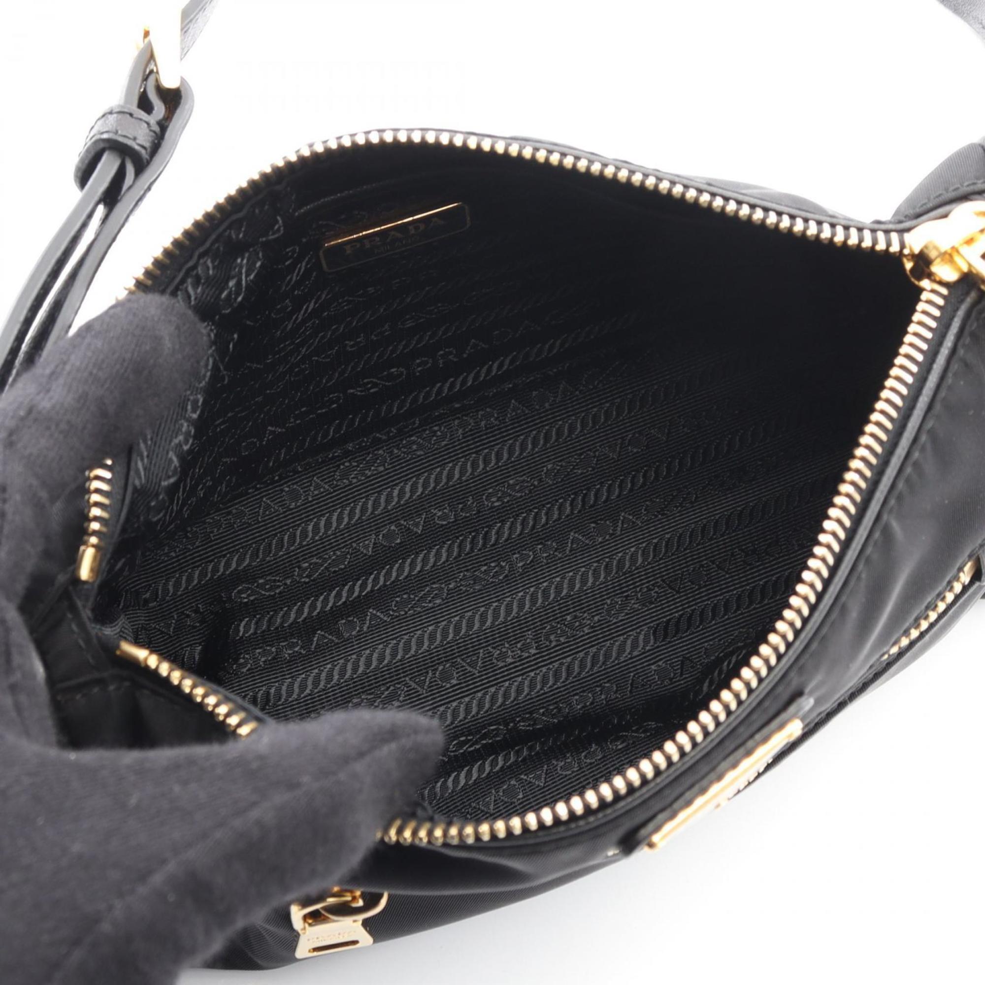 Prada handbag in nylon and Saffiano leather, black for women