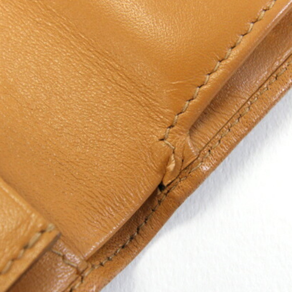 Celine bifold wallet in macadam, dark brown, beige, PVC, and leather. Compact wallet/mini wallet. For older women.