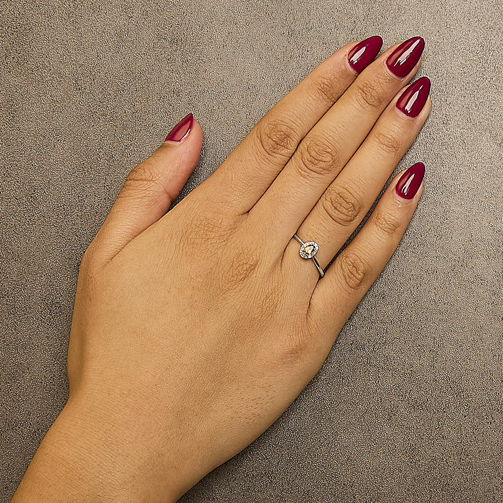 10K White Gold 5X3MM Oval Birthstone and Diamond Accent Halo Ring