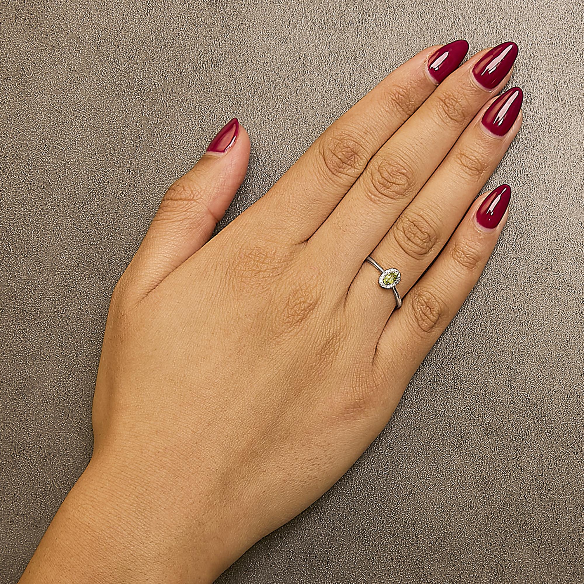 10K White Gold 5X3MM Oval Birthstone and Diamond Accent Halo Ring