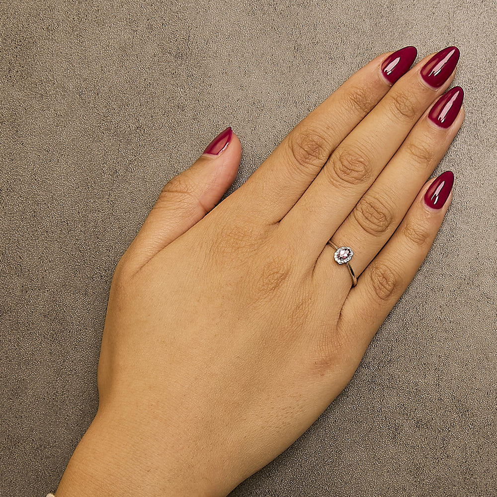 10K White Gold 5X3MM Oval Birthstone and Diamond Accent Halo Ring