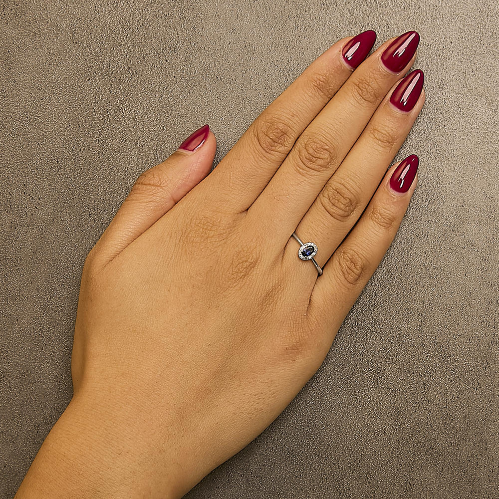 10K White Gold 5X3MM Oval Birthstone and Diamond Accent Halo Ring