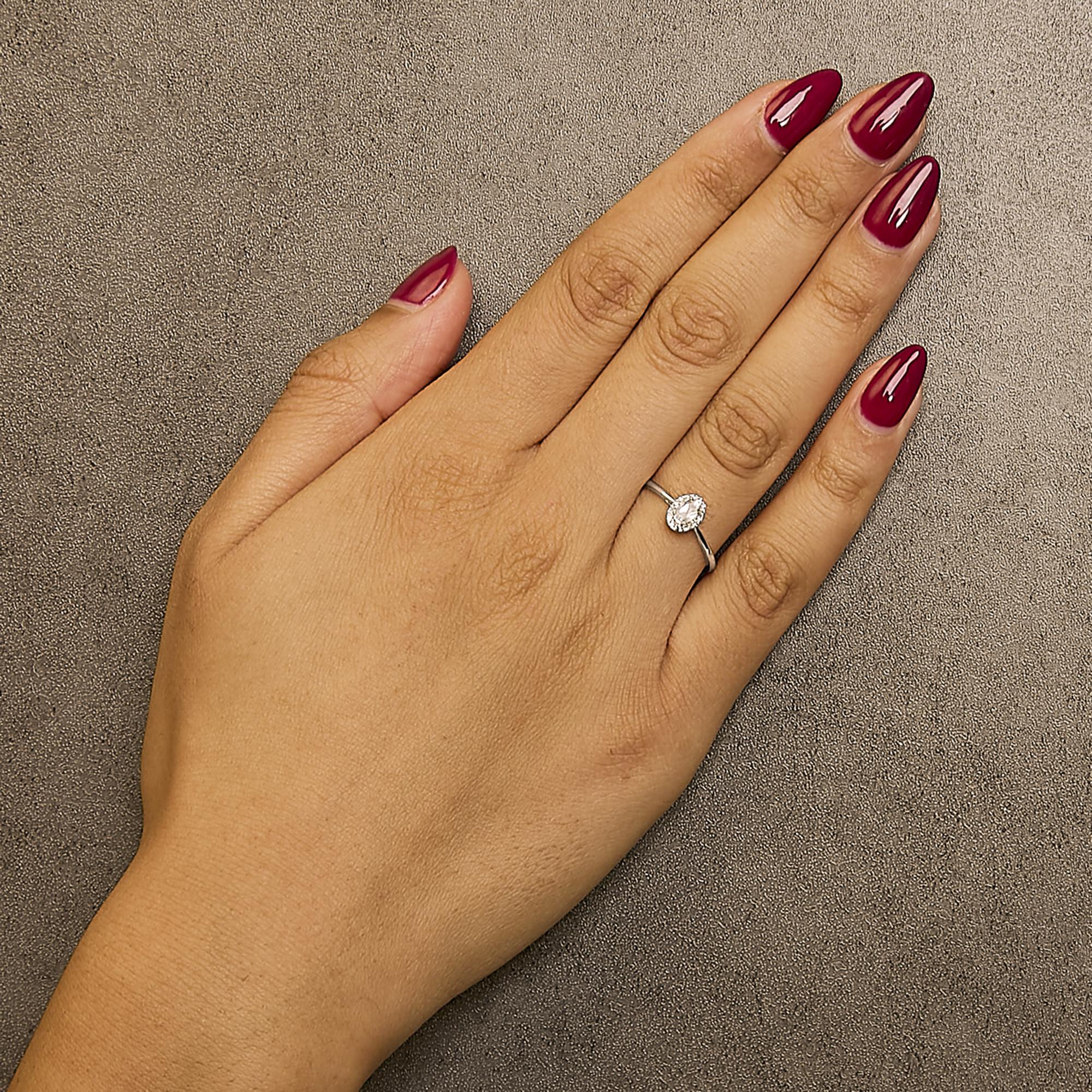 10K White Gold 5X3MM Oval Birthstone and Diamond Accent Halo Ring