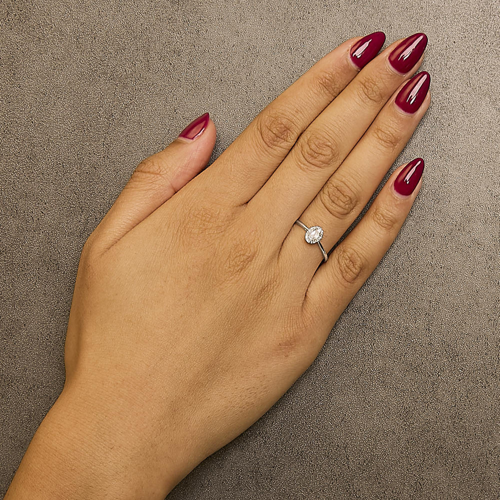 10K White Gold 5X3MM Oval Birthstone and Diamond Accent Halo Ring