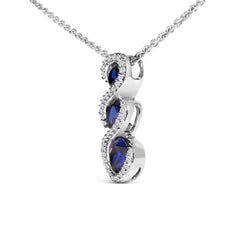 .925 Sterling Silver Created Blue and White Sapphire 3 Stone Swirl Pendant Necklace