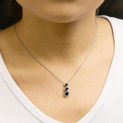 .925 Sterling Silver Created Blue and White Sapphire 3 Stone Swirl Pendant Necklace