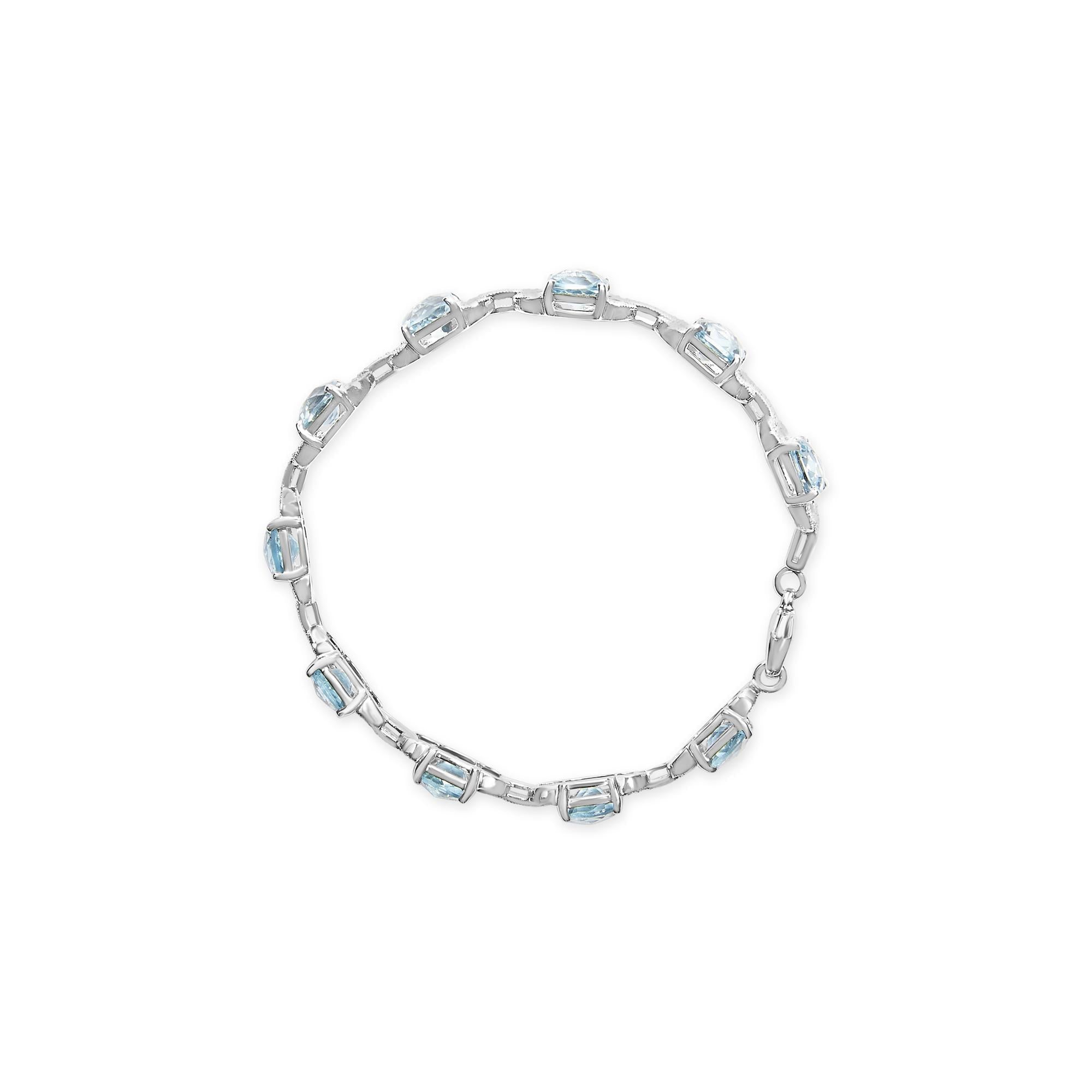 .925 Sterling Silver 7x7 mm Cushion Cut Blue Topaz and 1/20 cttw Round Cut Diamond Fashion Tennis Bracelet (I-J Color, I1-I2 Clarity) - 7"