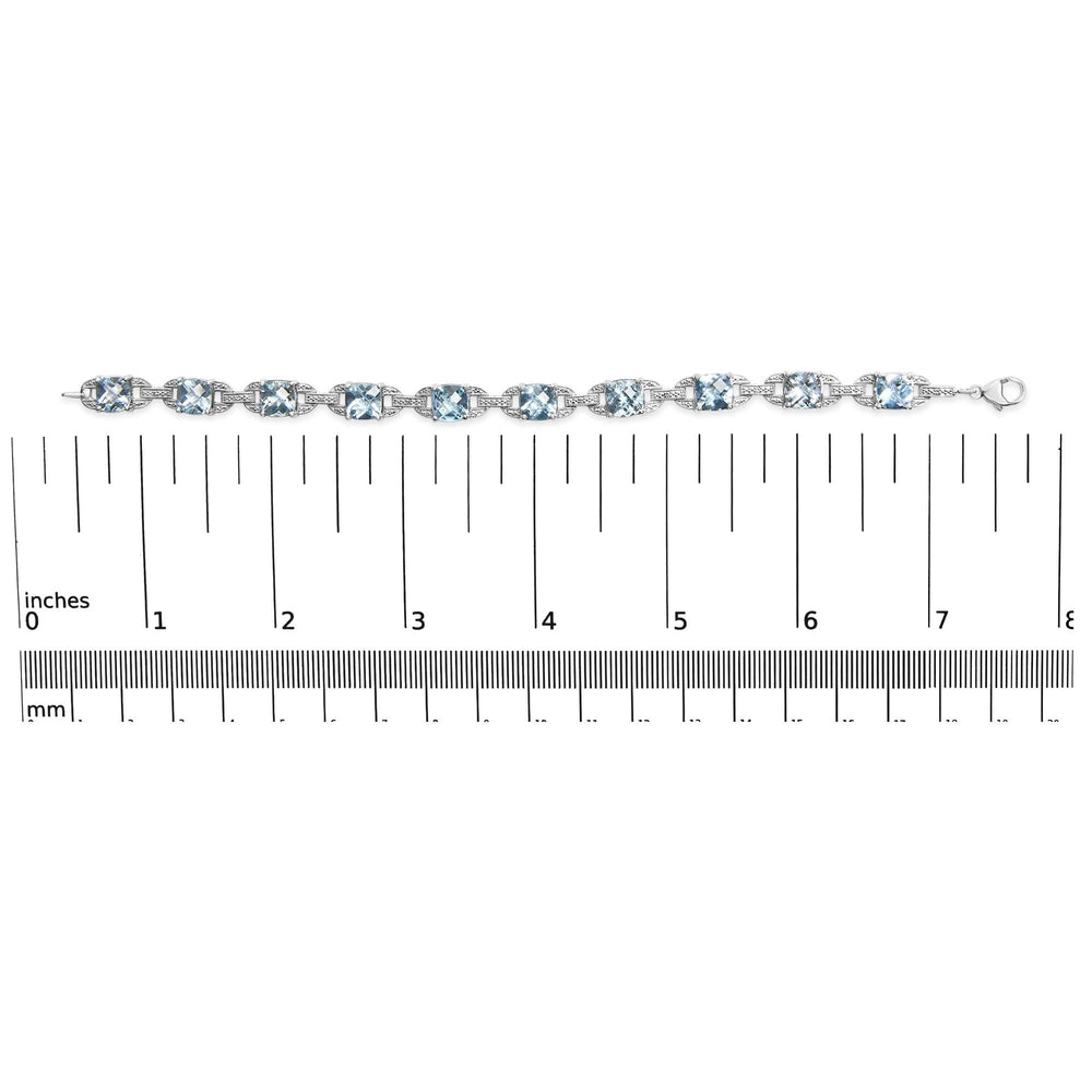 .925 Sterling Silver 7x7 mm Cushion Cut Blue Topaz and 1/20 cttw Round Cut Diamond Fashion Tennis Bracelet (I-J Color, I1-I2 Clarity) - 7"