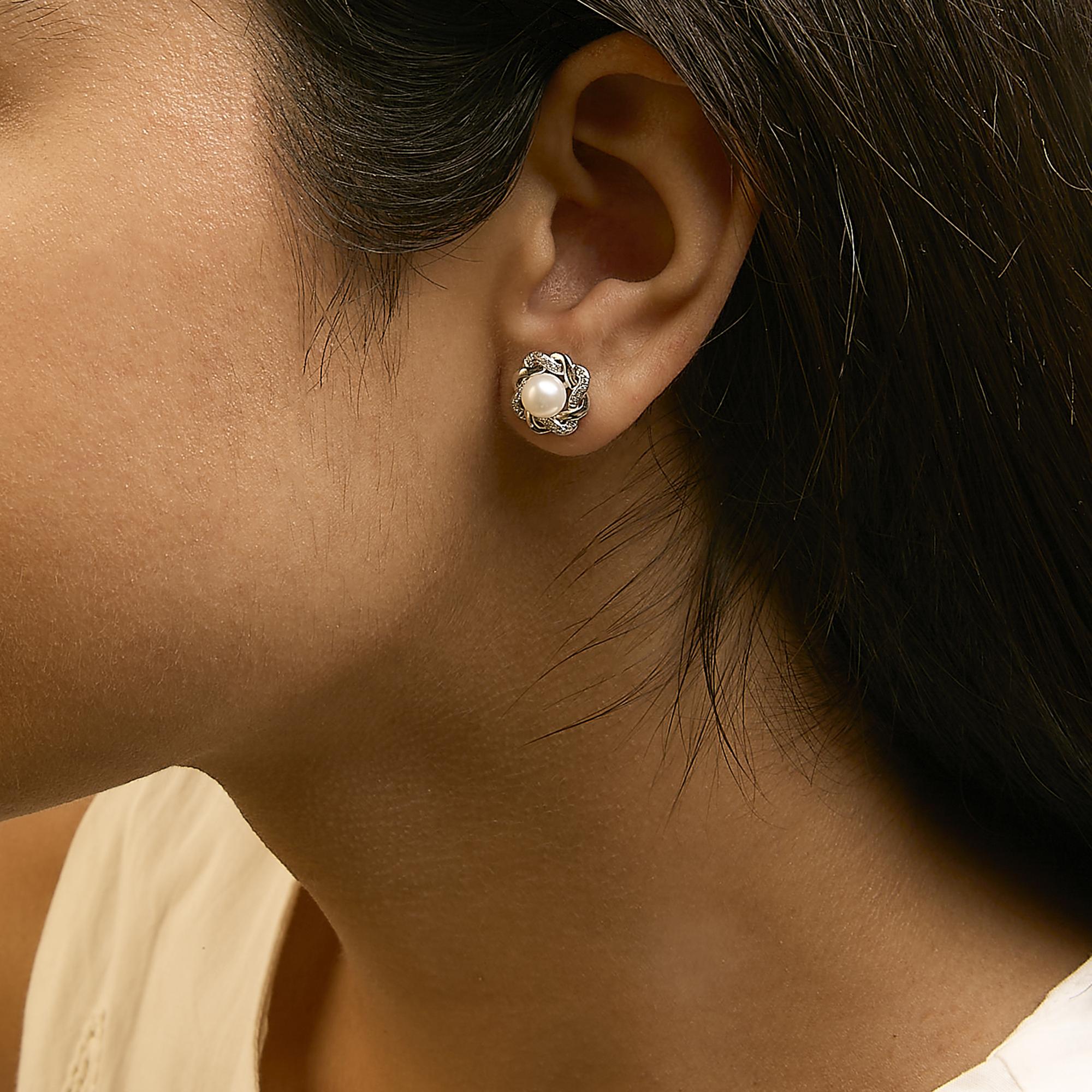 Sterling Silver Pearl and 1/10 Cttw Diamond Floral Twist Stud Earrings