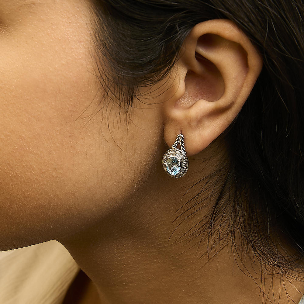 Sterling Silver Oval Blue Topaz and Diamond Accent Twist and Halo Drop Earrings